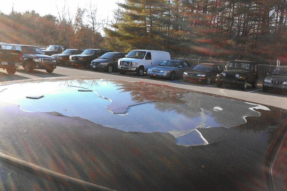 A parking lot with many cars parked in it