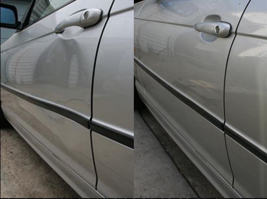 A car door with some scratches and dents