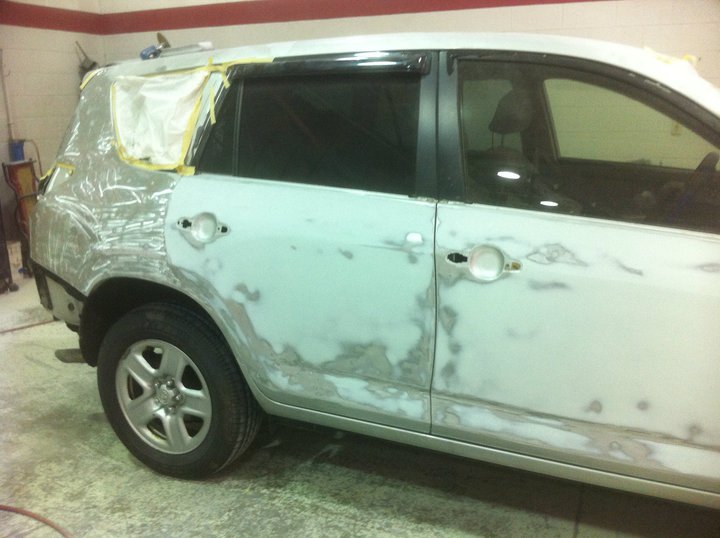 A car that has been damaged by the side of it.