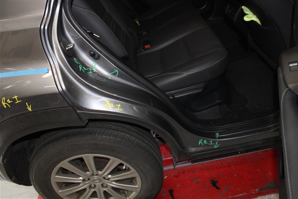 A car door with some stickers on it