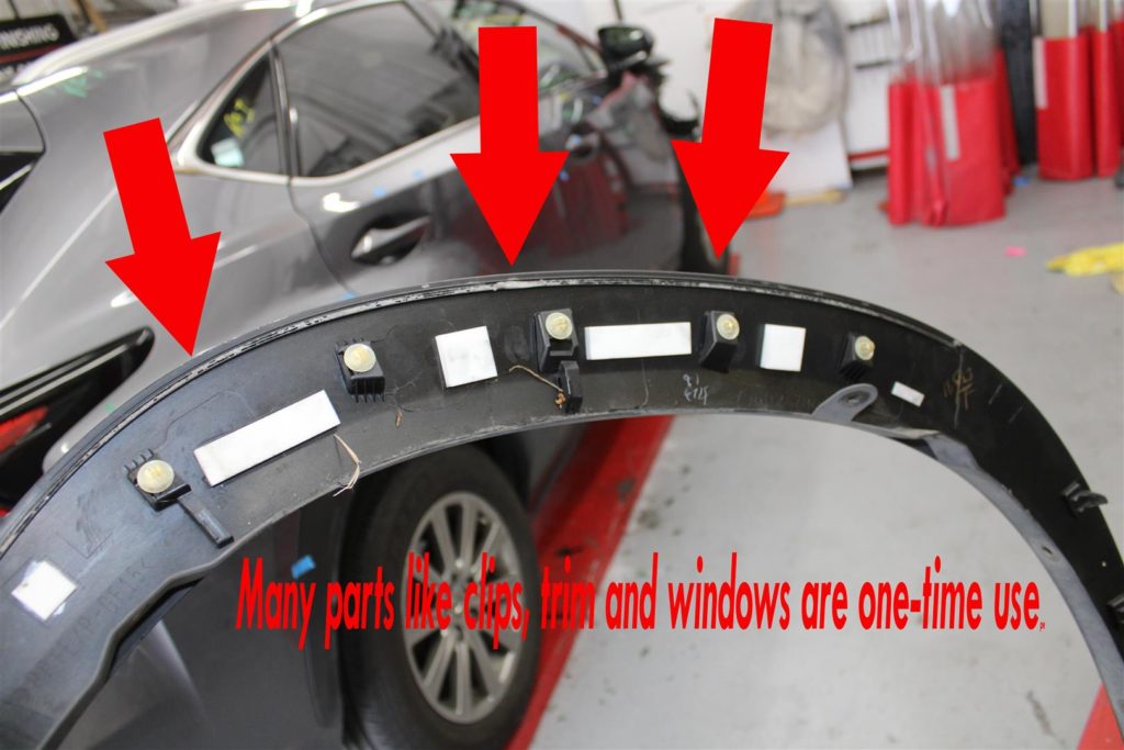 A car that has been bent over and is in the process of being repaired.