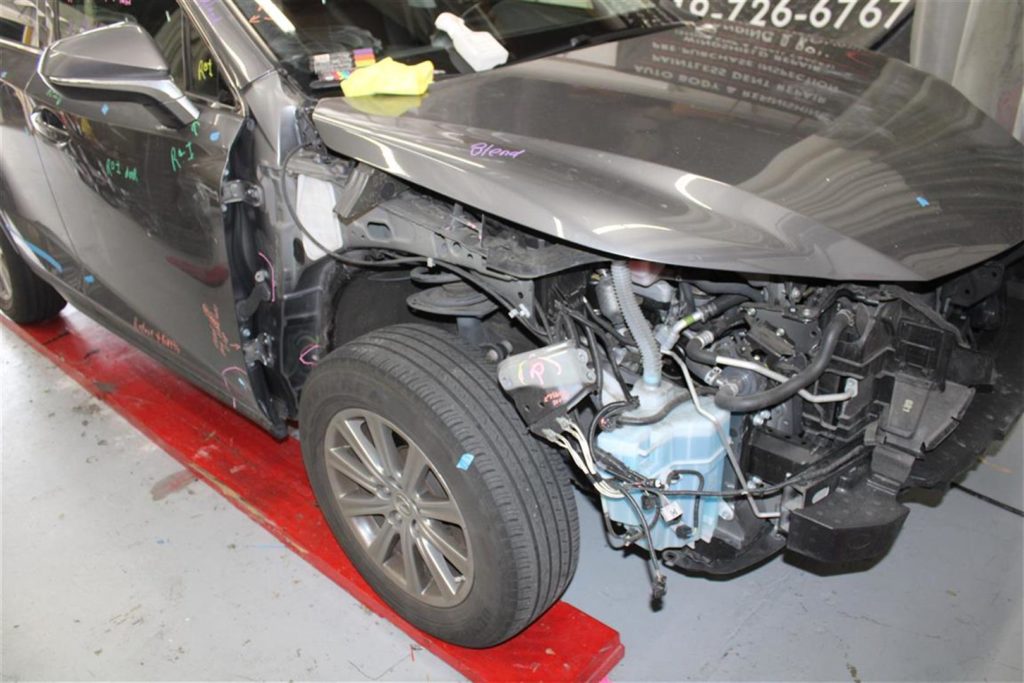 A car that has been smashed in to pieces.